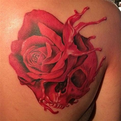 Womans Shoulder Rose And Skull Tattoo