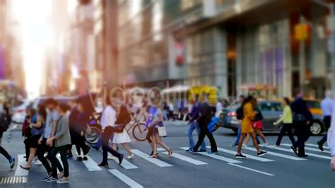 Crowd Of People Walking On Busy City Street At Rush Hour Traffic