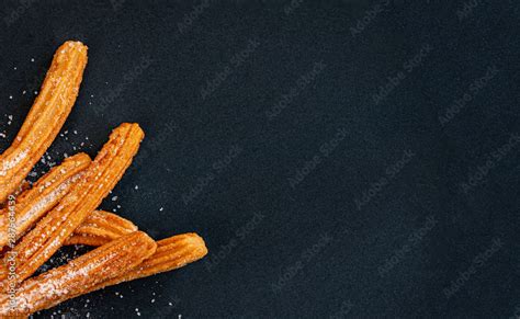 Churro On A Black Background Traditional Spanish Cusine Churros In A