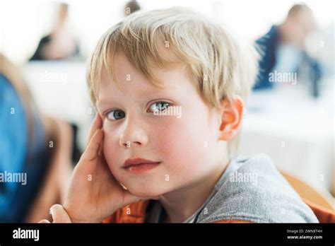 Portrait Of Young Boy Looking At Camera Copenhagen Denmark Stock