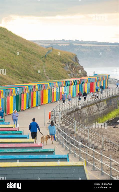 Colourful Row Of Beach Huts On The Seafront In Whitby North Yorkshire