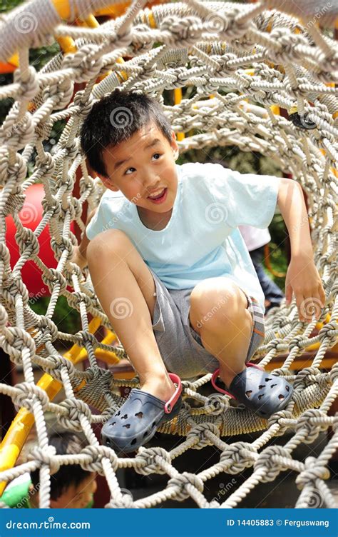 A Child Climbing A Jungle Gym Stock Image Image Of Clothing