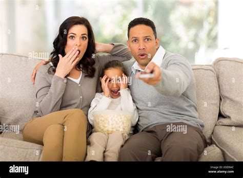 family watching scary movies at home Stock Photo - Alamy