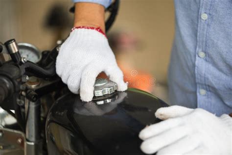 Mechanic Repairing Motorcycle In Workshop Garage Man Fixing Motorbike