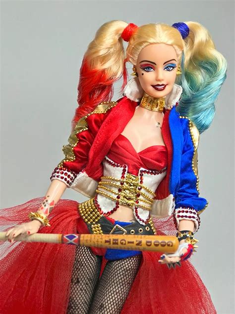 A Barbie Doll Dressed In Red White And Blue Holding A Stick With Both