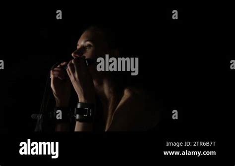 Beautiful Naked Woman In Handcuffs Holding A Whip On Black Background BDSM Concept Stock Video