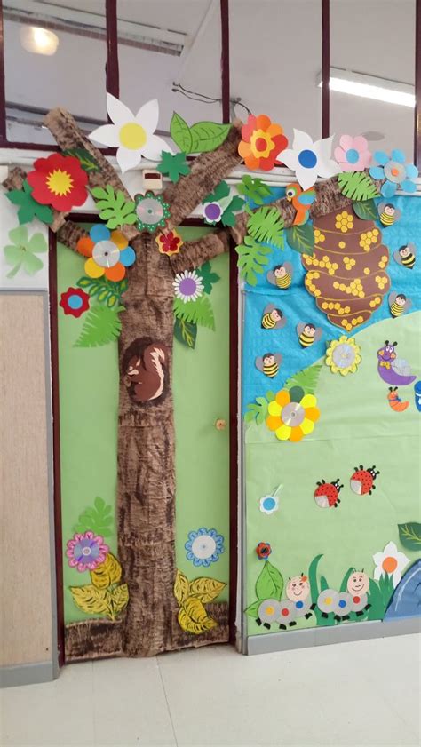 Two Doors Decorated With Paper Flowers And Leaves One Has A Tree In