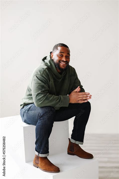 Joyful Smiling Mature Black Man Sitting Down Inside Stock Photo Adobe