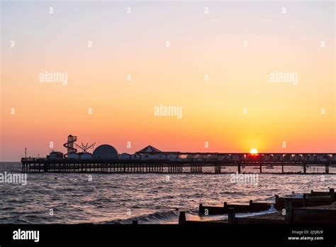 Windy Morning Sunrise Over The Pier At Herne Bay With The Foreground