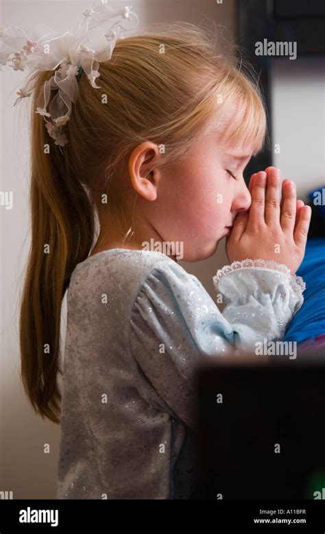 Girl Praying Stock Photo Alamy