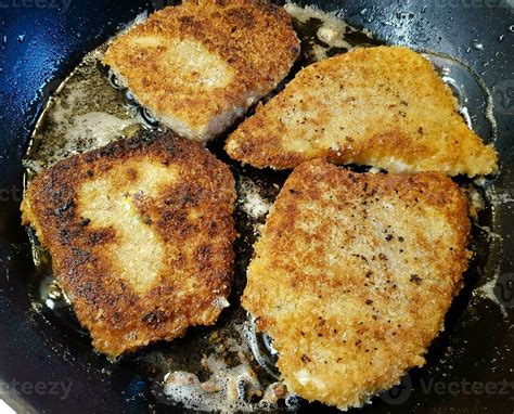 breaded wiener schnitzel with side dishes 24056084 Stock Photo at Vecteezy