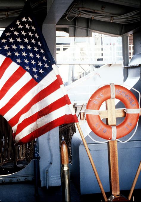 A Close Up View Of The American Flag On The Dock Landing Ship Uss