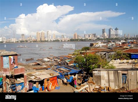 Huts and background city skyline ; Worli Village ; Worli Koliwada ...