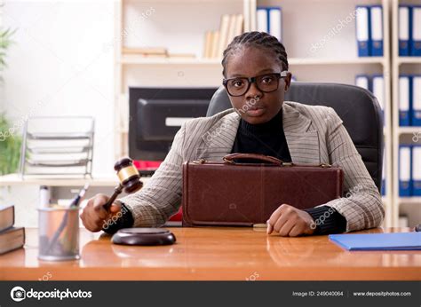 Black female lawyer in courthouse — Stock Photo © Elnur_ #249040064