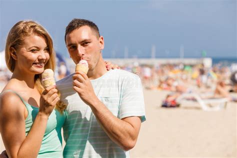 Man And Woman Eating Ice Cream On Beach Stock Image Image Of Positive