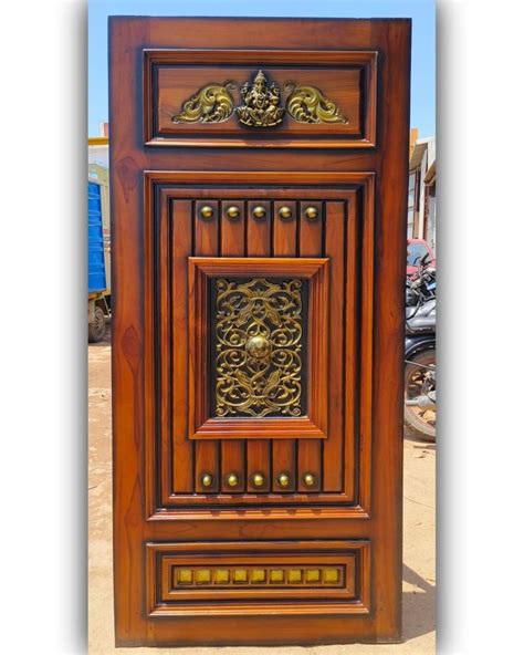 A Wooden Door With Ornate Carvings On It