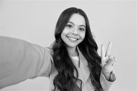 Premium Photo Fashion Teen Girl In Trendy Wear Making Selfie Posing On Yellow Background