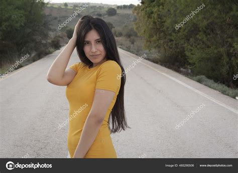Sexy Latina Female Wearing Tight Yellow Dress Posing Road Stock Photo Wirestock