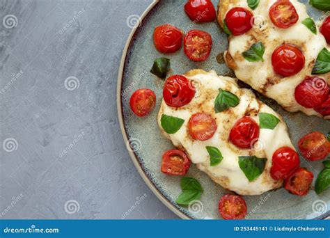 Homemade Caprese Chicken Parmesan With Tomato Mozzarella And Basil On A Plate Top View Space