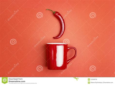 Red Coffee Mug With Chili Peppers On A Red Background The Concept Of A Hot Drink Stock Image