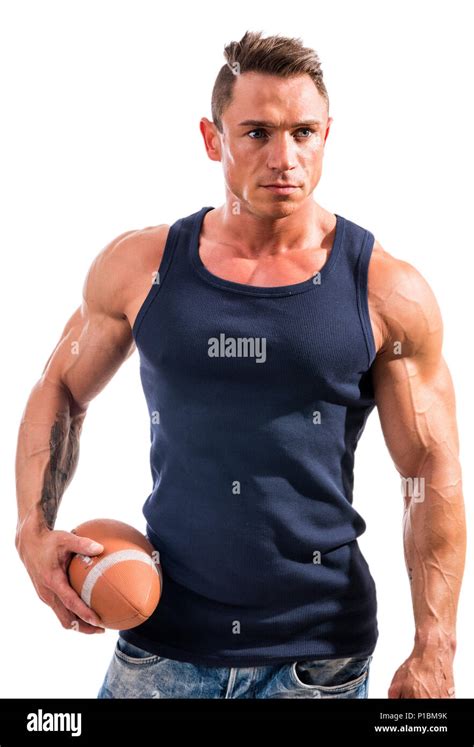 Muscular Man Holding Football Or Rugby Ball Stock Photo Alamy