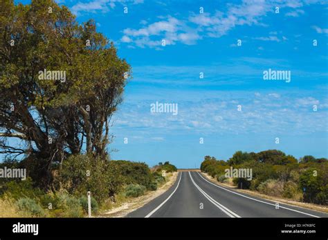 Long Stretch Of Road In The Australian Outback During A Summer Road