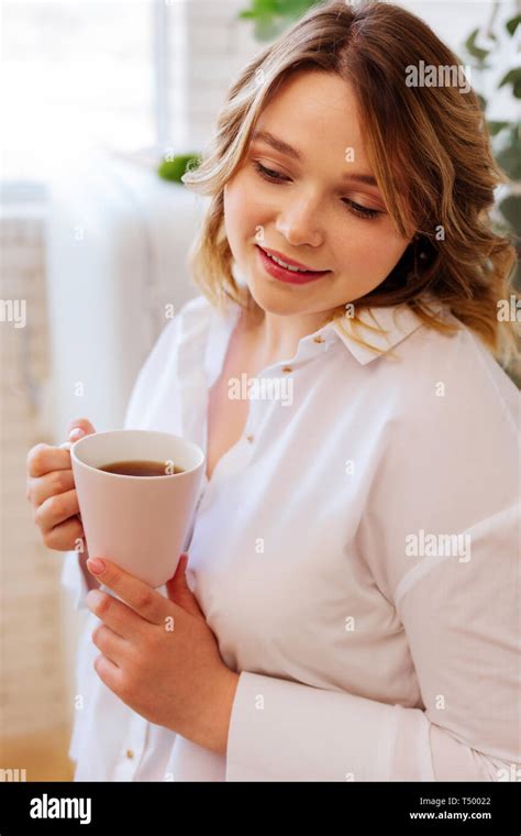 Hot Drink Nice Attractive Woman Holding A Cup With Hot Tea While Drinking It In The Kitchen