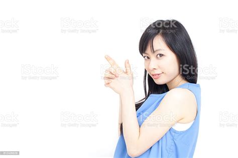 Japanese Woman With Hands Shaped Like Gun Stock Photo Download Image