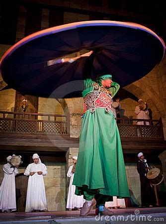 A Man In Costume Is Holding An Umbrella Over His Head While Other