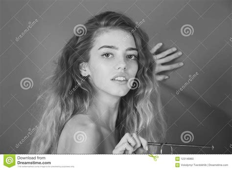 Woman With Naked Shoulders Holding Metallic Nail In Hand Stock Photo Image Of Metallized Cute