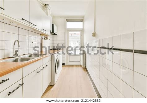 Kitchen Interior Orange Countertop White Tiled Stock Photo 2121442883 ...