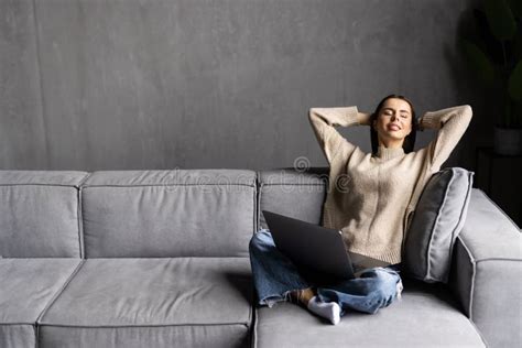 Happy Woman Using Laptop Sitting On Cosy Sofa Stock Image Image Of