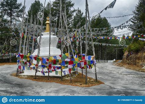 Chorten and Prayer Flags in the Snow Repeating Mantra Stock Image ...