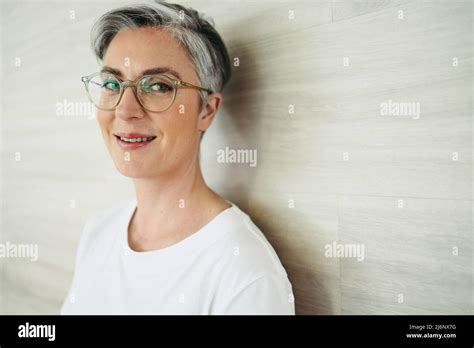 Portrait Of A Mature Businesswoman Smiling At The Camera While Wearing