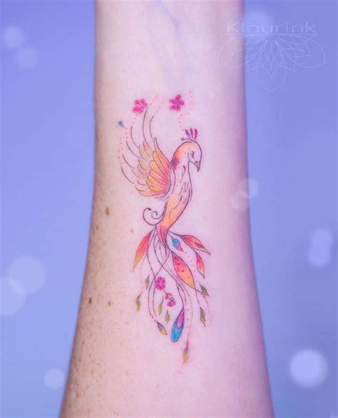 A Colorful Bird Tattoo On The Wrist