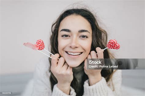 Young Beautiful Woman Posing With Valentines Day Heart Shaped Candies