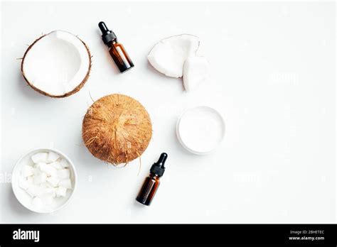 Flat Lay Composition With Coconut Essential Oil Bottles Moisturizing