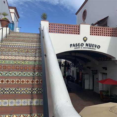 an entrance to a restaurant with colorful stairs and tiled steps ...