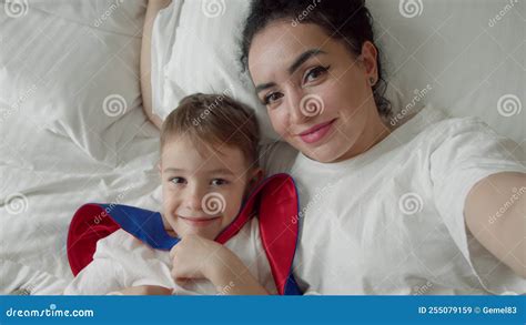 Portrait Happy Cute Funny Cheerful Mom And Son Gently Hugging Son In