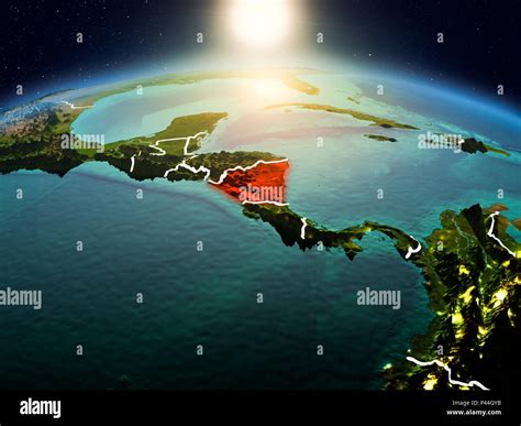 Sunrise Above Nicaragua Highlighted In Red On Model Of Planet Earth In