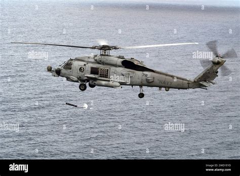 An MH 60R Sea Hawk Helicopter Launches A Sonobuoy During Anti Submarine