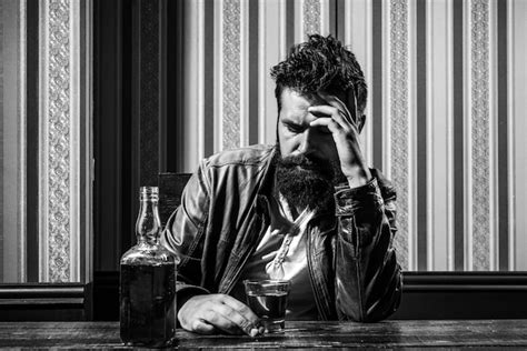 Premium Photo Man With Beard Holds Glass Brandy Man Holding A Glass