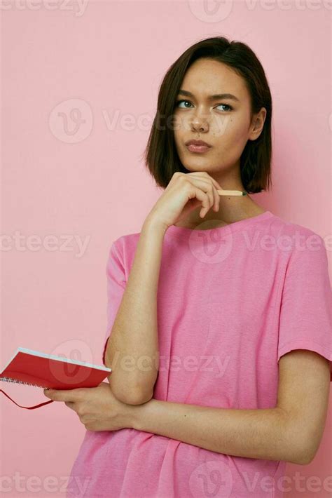 Short Haired Brunette Emotions Posing With Notepad Learning Pink