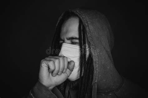 Coughing young man in mask stock photo. Image of pollution - 208092610