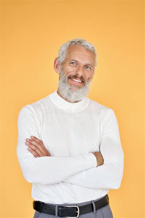 Happy Senior Old Business Man Standing Isolated On Yellow Background