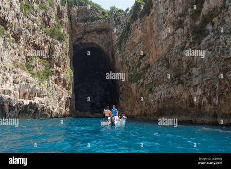 Tourist Boat In Front Of The Haxhi Ali Cave Peninsula Of Karaburun