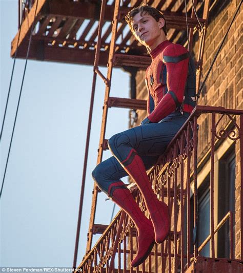 Tom Holland Dangles Off A Balcony While Performing Stunts For Spider