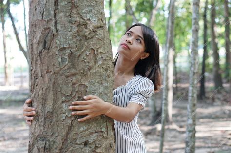 Premium Photo Asian Women Hugging Trees Concept Of Love For The World