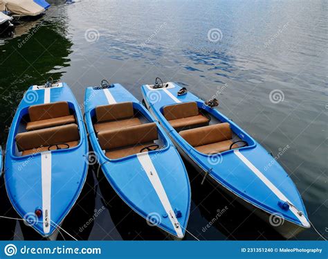 Blue Canoes On The Shore Of The Bow River In Banff National Park Stock