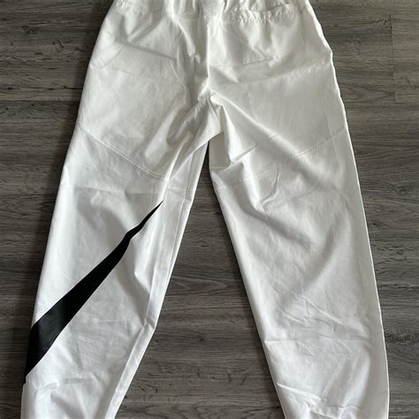 White Nike Big Swoosh Joggers Size Small. Will fit a... - Depop